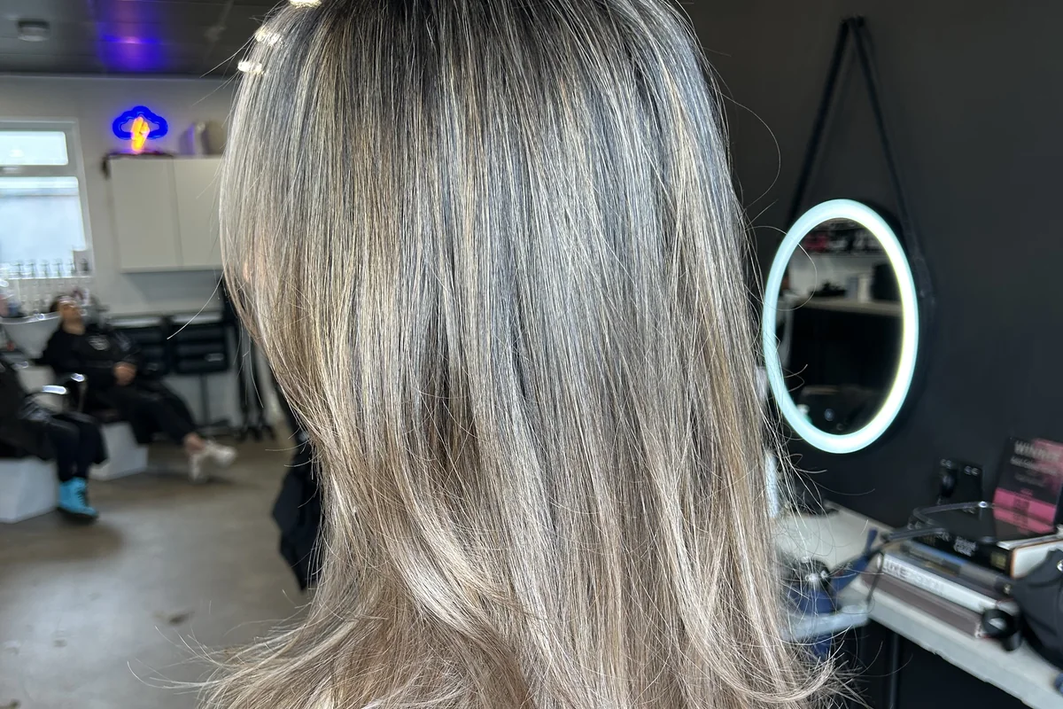 Silver-blonde layered hair viewed from the back