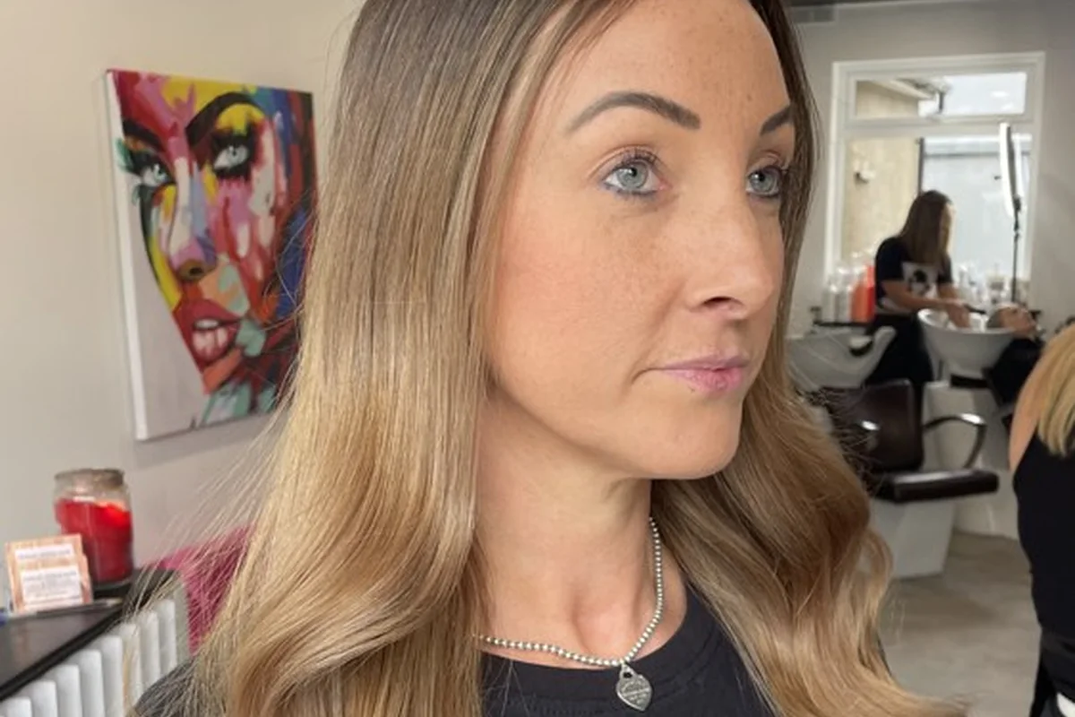 Softly blended blonde hair with a darker root