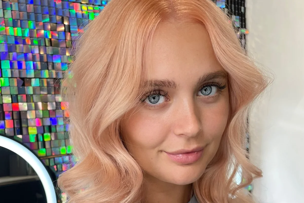 Soft peach-toned hair framing a client’s face