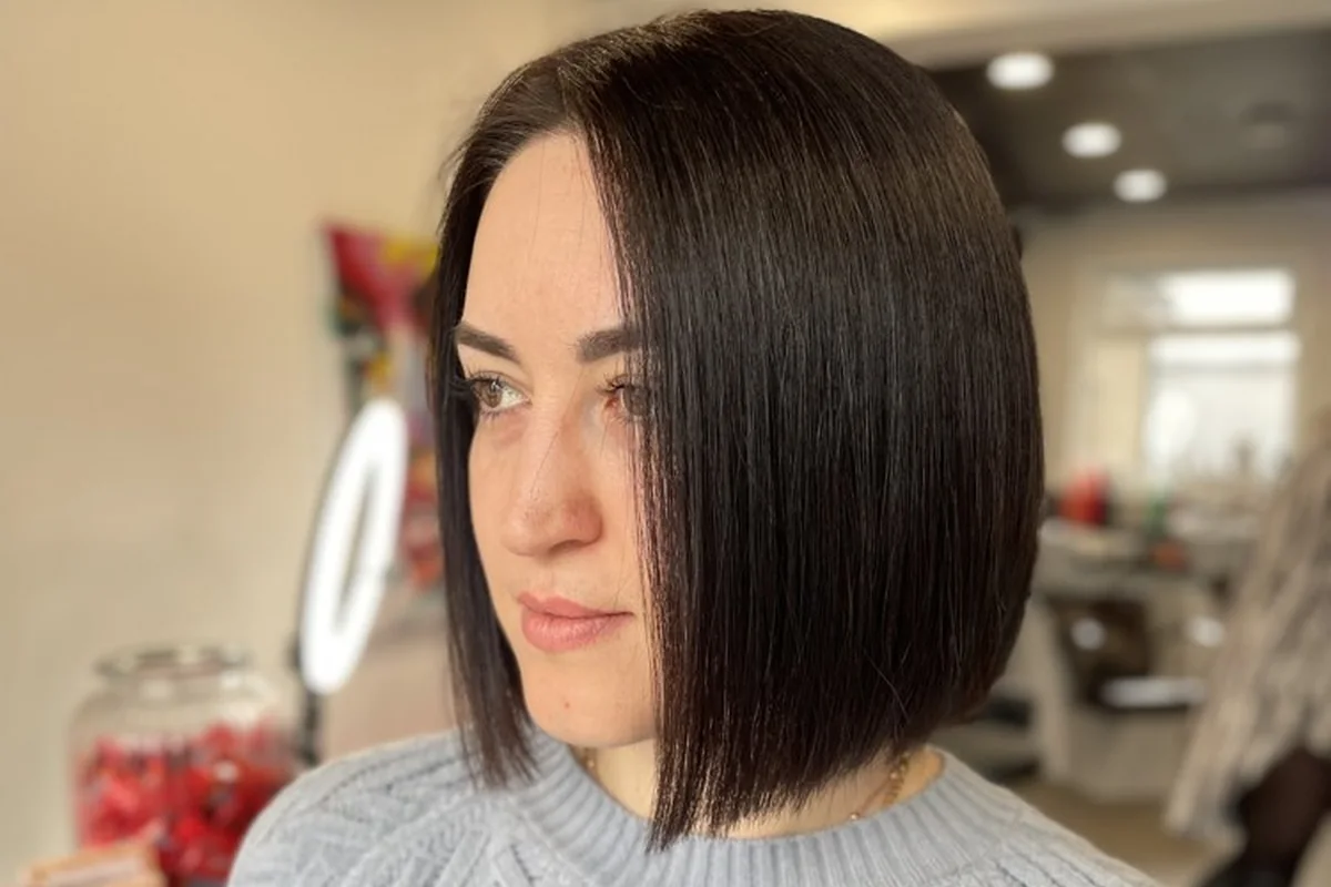 A clean chin-length brunette bob