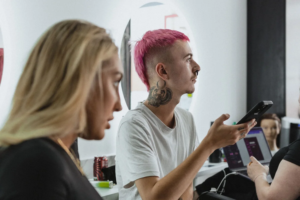 Stylists and clients talking in the salon