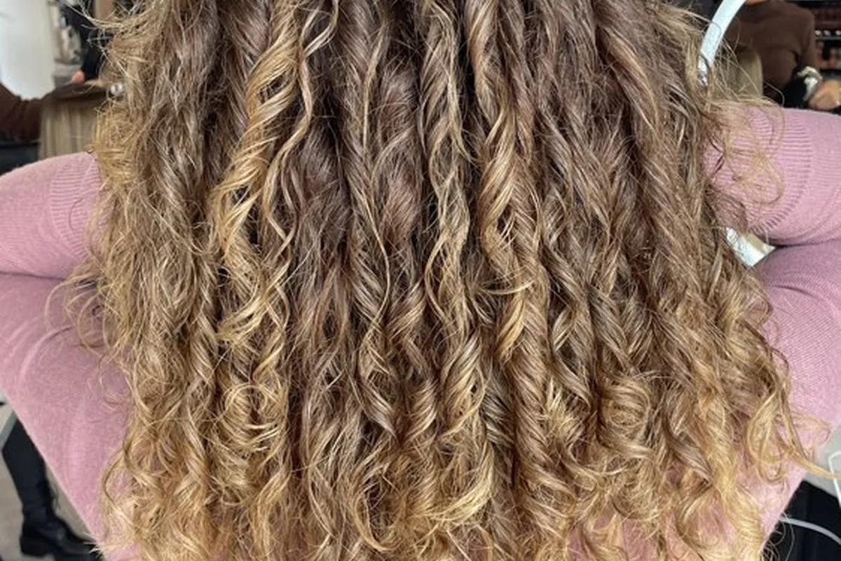 Defined blonde curls viewed from the back