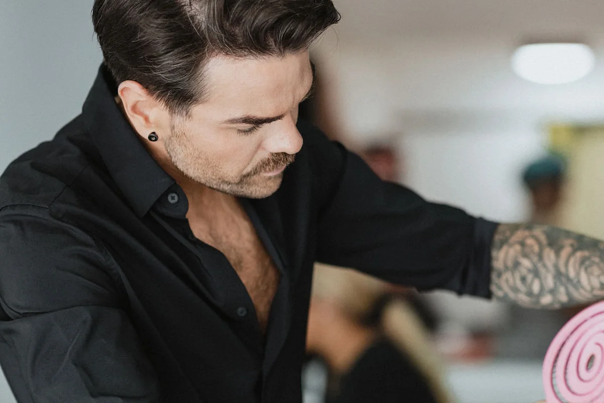 Fergal working carefully on a client’s hair